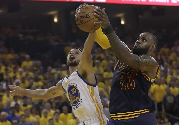 LeBron James battles for the ball during Game 1 of the 2017 NBA Finals. (AP)