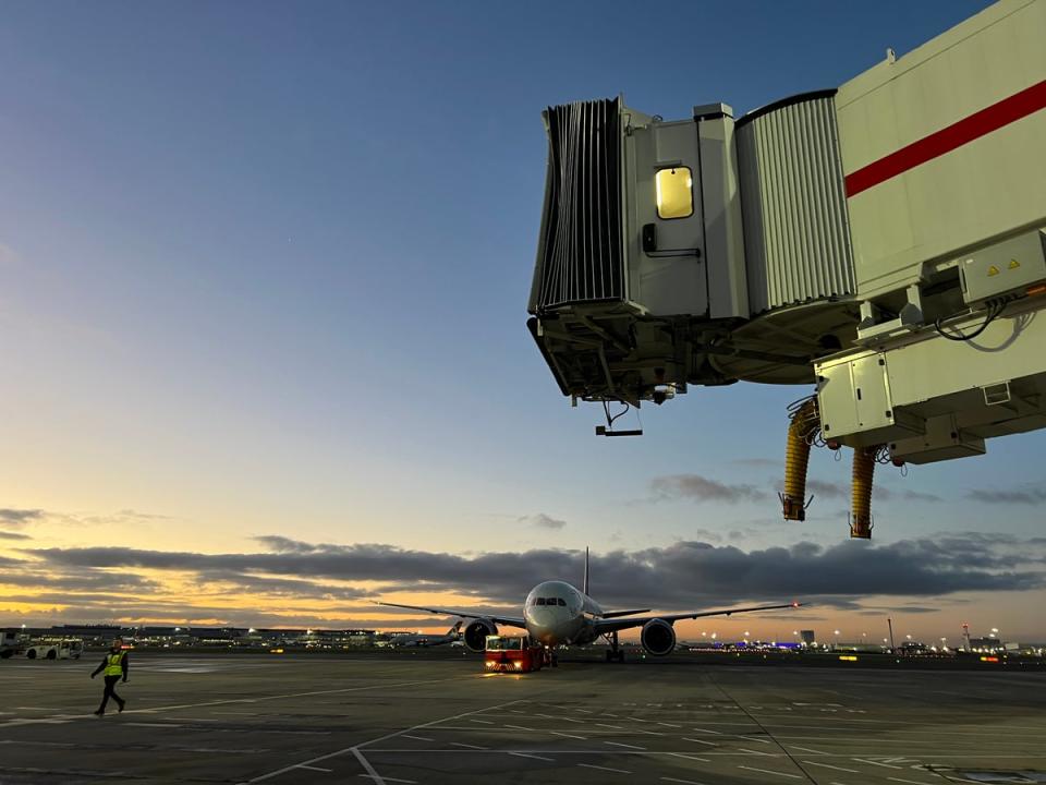 New dawn? Sunrise over London Heathrow airport as the Virgin Atlantic Boeing 787 is towed onto stand 1 at Terminal 3 (Simon Calder)