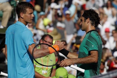 Mar 30, 2017; Miami, FL, USA; Roger Federer of Switzerland (R) shakes hands with Tomas Berdych of the Czech Republic (L) after their match in a men's singles quarter-final during the 2017 Miami Open at Crandon Park Tennis Center. Federer won 6-2, 3-6, 7-6(6). Geoff Burke-USA TODAY Sports