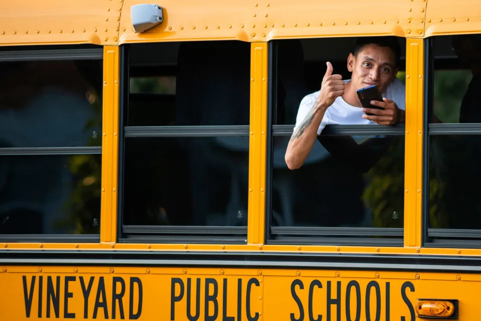 A man, who is part of a group of migrants that had just arrived, flashes a thumbs-upy Sept. 14, 2022, in Edgartown, Mass., on Martha's Vineyard.