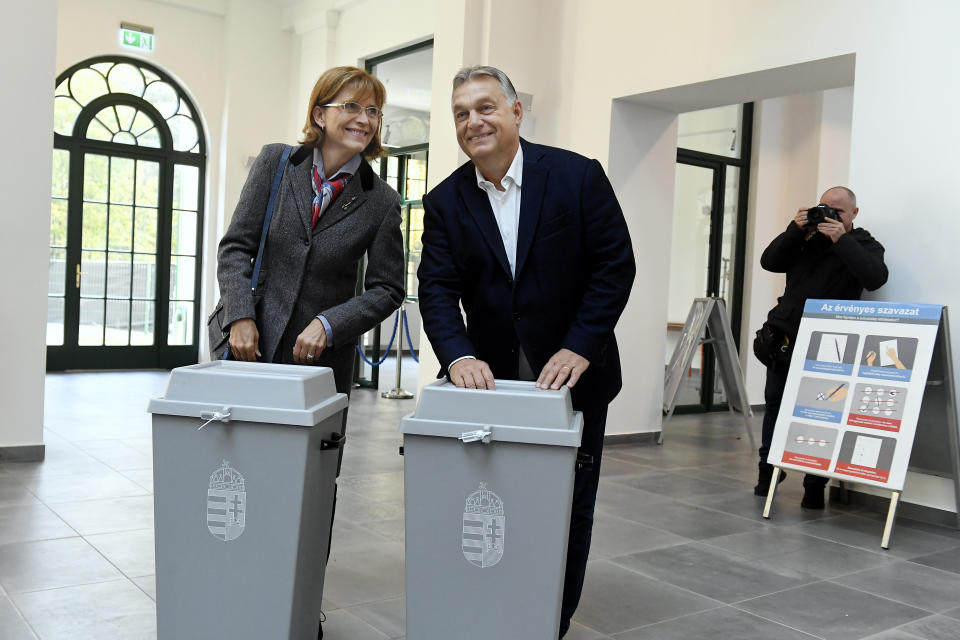 Hungarian Prime Minister Viktor Orban of the governing Fidesz party and his wife, Aniko Levai cast their ballots at the nationwide local elections in Budapest, Hungary, Sunday, Oct. 13, 2019. (Szilard Koszticsak/MTI via AP)