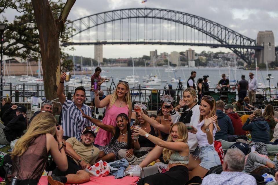 Group of friends gathered on Sydney harbour to celebrate the New Year's Eve on December 31, 2022. (Photo by Roni Bintang/Getty Images)