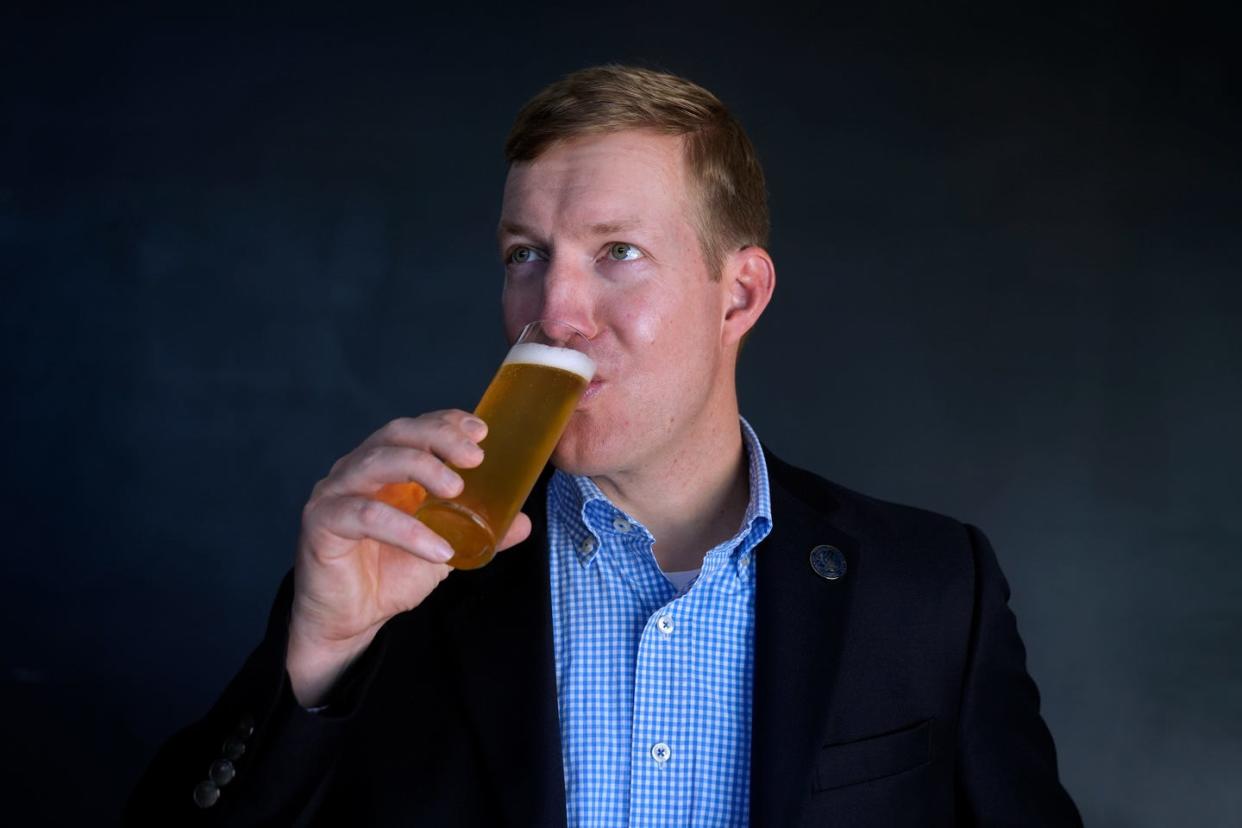 Nils Weldy, executive director of the Rhode Island Craft Beer Guild, sips a beer at Proclamation Brewing in Warwick in June.