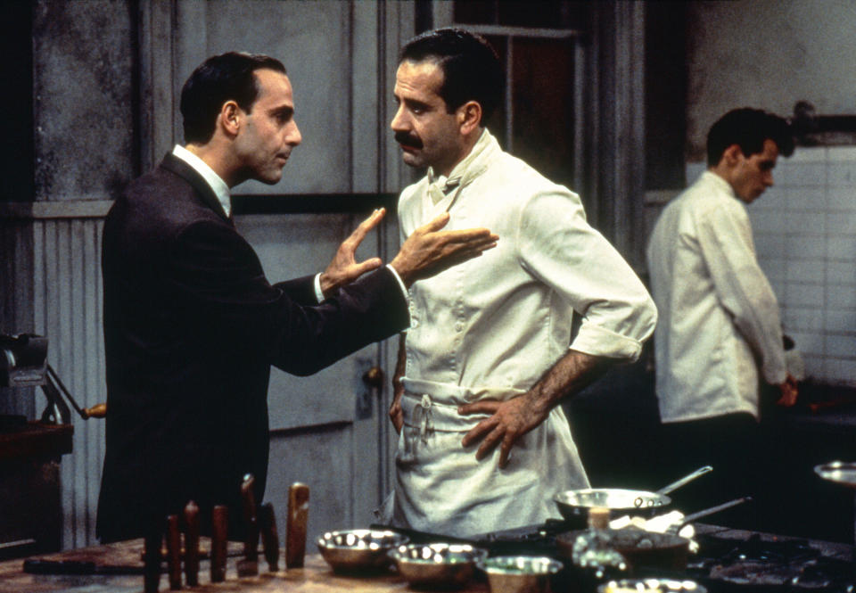 Stanley Tucci talks to Tony Shaloub in the kitchen