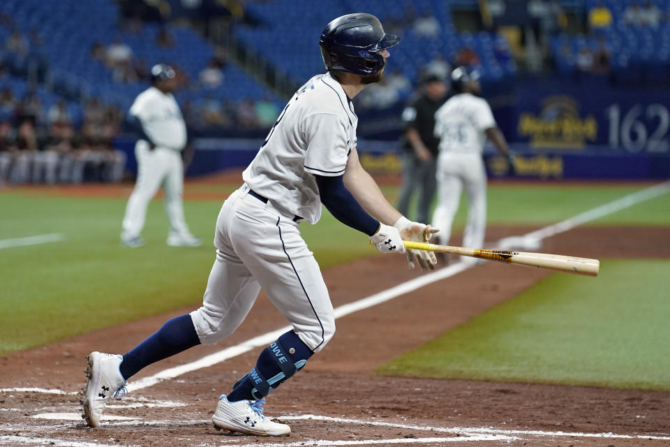 Tampa Bay Rays' Brandon Lowe follows the flight of his two-run home run off Baltimore Orioles starting pitcher Keegan Akin during the fourth inning of a baseball game Friday, June 11, 2021, in St. Petersburg, Fla. (AP Photo/Chris O'Meara)