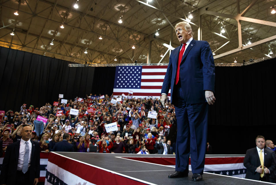 President Donald Trump arrives to speak at a rally at the IX Center, in Cleveland, Monday, Nov. 5, 2018, (AP Photo/Carolyn Kaster)