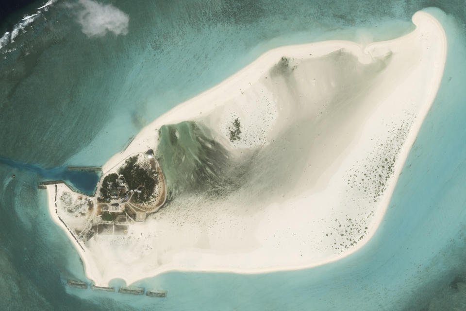 This satellite photo from Planet Labs PBC shows Triton Island in the South China Sea on Feb. 20, 2023. China appears to be constructing an airstrip on a disputed South China Sea island that is also claimed by Vietnam and Taiwan, according to satellite photos analyzed by The Associated Press on Wednesday, Aug. 16, 2023. (Planet Labs PBC via AP)