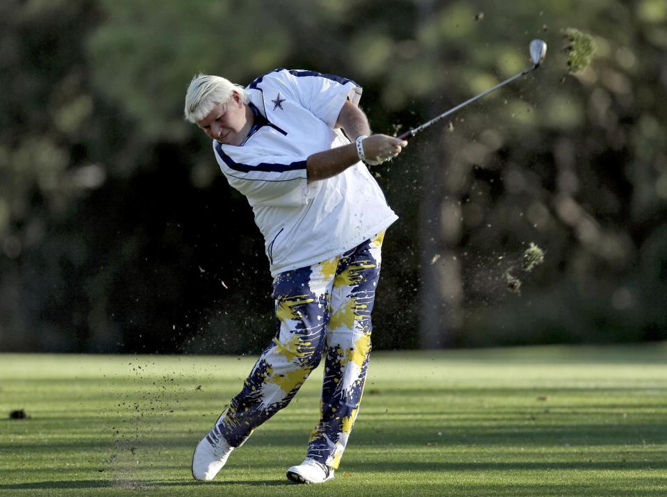 John Daly takes a divot as he hits from the seventh fairway during the second round of the Valspar Championship golf tournament at Innisbrook Friday, March 14, 2014, in Palm Harbor, Fla. (AP Photo/Chris O'Meara)