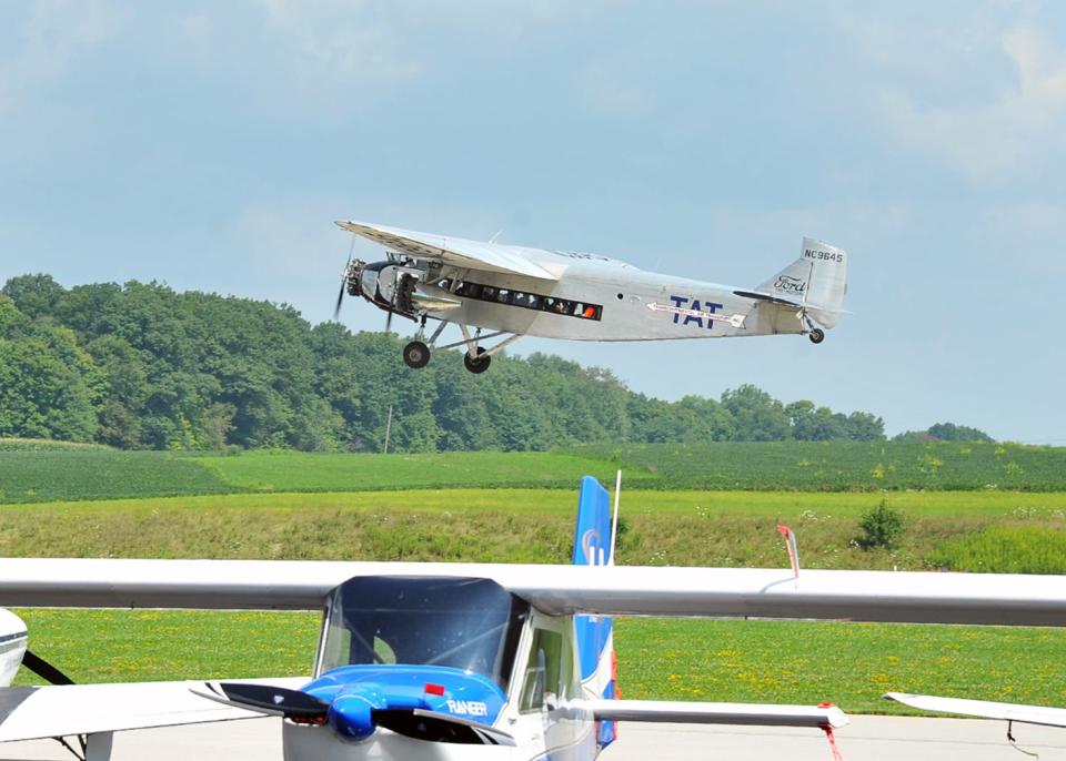 A Ford Tri-Motor airplane takes off from the runway at the Wayne County airport. The craft spent a weekend offering rides in the 1920-era craft.