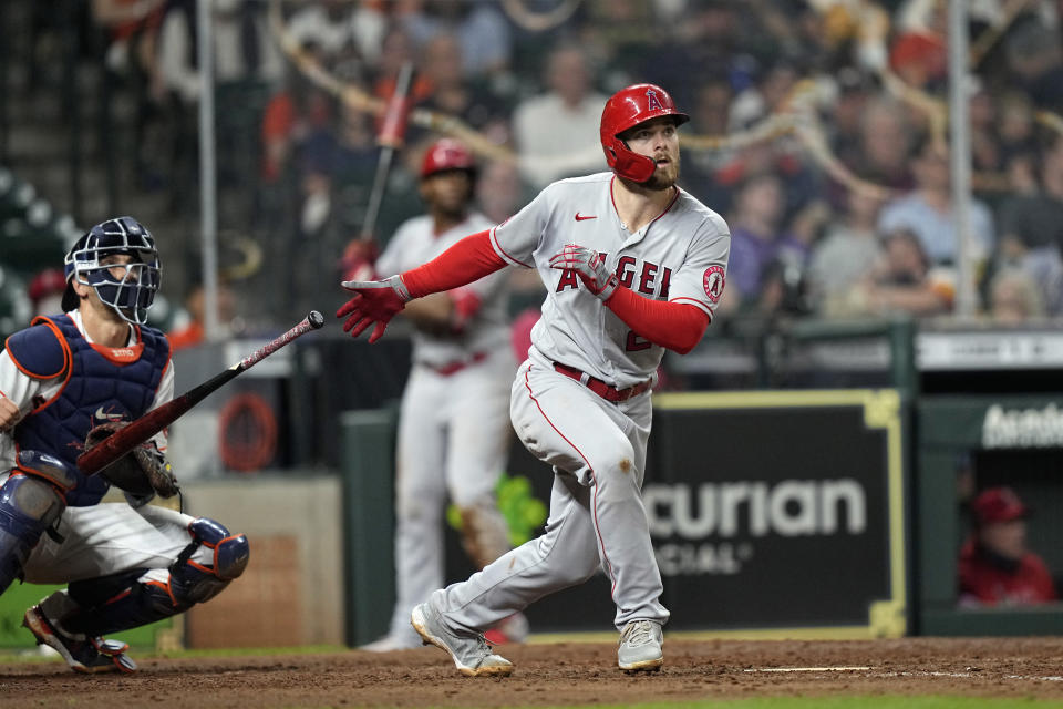 Los Angeles Angels' Jared Walsh, right, hits a home run as Houston Astros catcher Jason Castro watches during the sixth inning of a baseball game Monday, May 10, 2021, in Houston. (AP Photo/David J. Phillip)