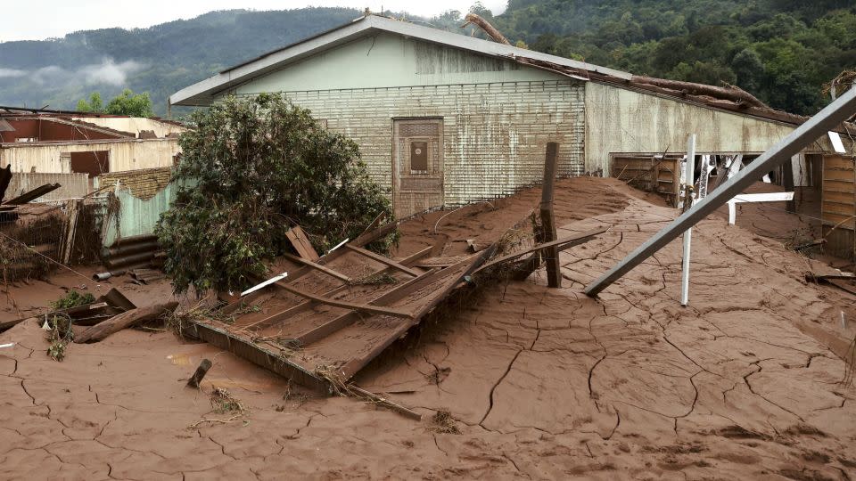 Mud left after floodwaters receded in Jacarezinho. - Diego Vara/Reuters