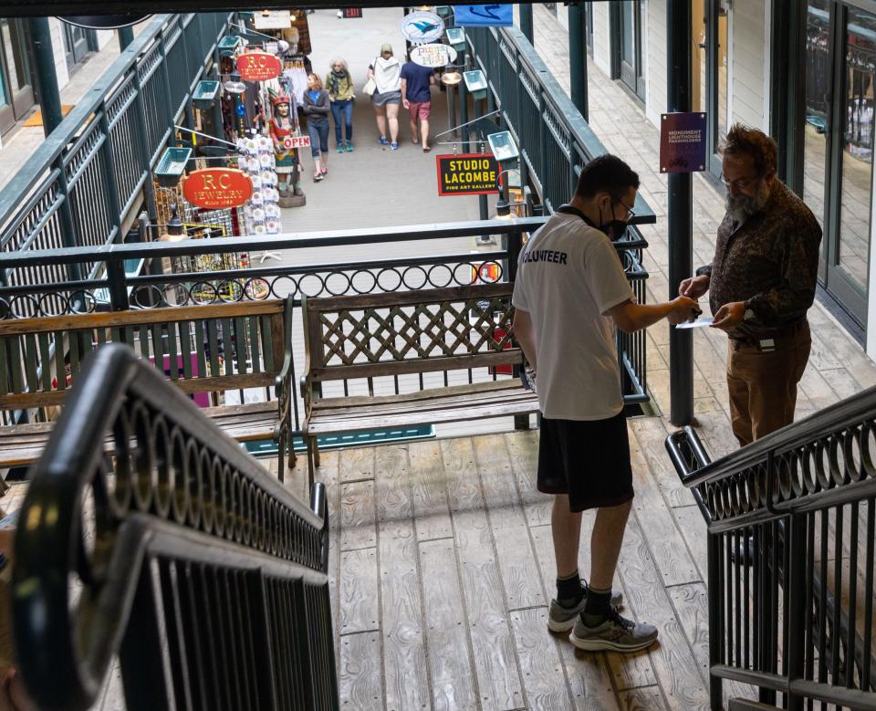 A movie-goer at the Provincetown International Film Festival gets his ticket scanned on Thursday at Waters Edge Cinema.