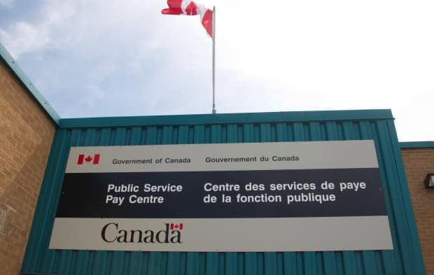 Due to an error made by the federal department's Public Service Pay Centre, about 1,000 employees have been paying into the wrong pension plan and some must now pay thousands back to the government.  (Ron Ward/Canadian Press - image credit)