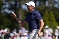 Rory McIlroy, of Northern Ireland, waves after making a putt on the 18th hole during final round at the Masters golf tournament at Augusta National Golf Club Sunday, April 14, 2024, in Augusta, Ga. (AP Photo/Ashley Landis)