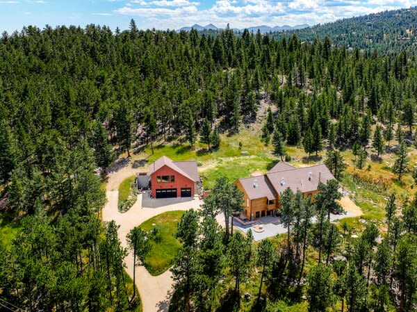 Soaring trees surround the 4,488-square-foot home, ensuring ample peace and privacy.