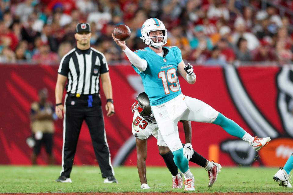 Aug 23, 2024; Tampa, Florida, USA; Miami Dolphins quarterback Skylar Thompson (19) throws the ball against the Tampa Bay Buccaneers in the second quarter during preseason at Raymond James Stadium. Mandatory Credit: Nathan Ray Seebeck-USA TODAY Sports