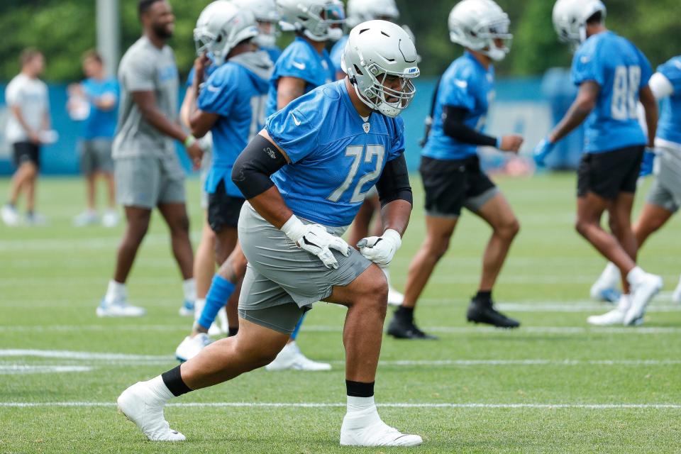 Detroit Lions guard Halapoulivaati Vaitai (72) warms up during minicamp at Detroit Lions Headquarters and Training Facility in Allen Park on Tuesday, June 6, 2023.
