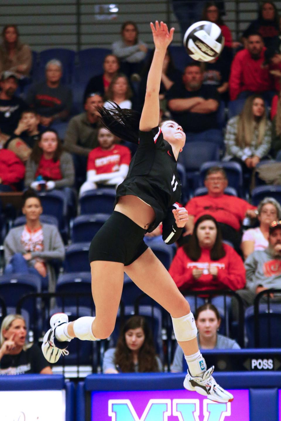Cardington's Audrey Brininger goes up for a kill against Pleasant during a Division III volleyball district championship match Saturday night at Mount Vernon Nazarene's Ariel Arena.