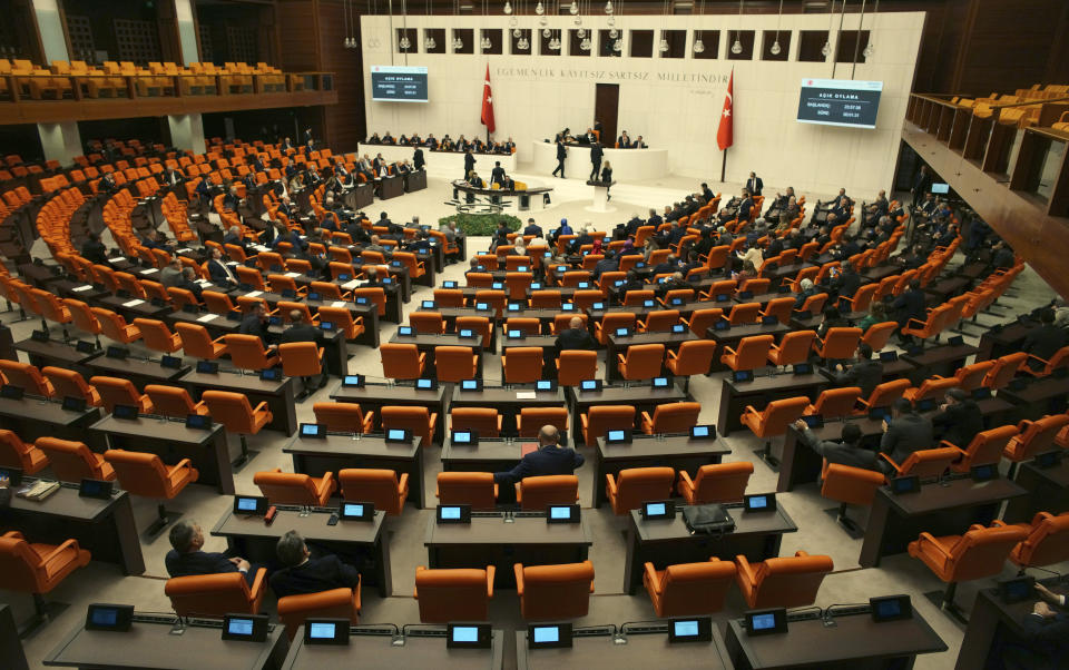 Turkish lawmakers vote in favor of Finland's bid to join NATO, late Thursday, March 30, 2023, at the parliament in Ankara, Turkey. All 276 lawmakers present voted unanimously in favor of Finland's bid, days after Hungary's parliament also endorsed Helsinki's accession.(AP Photo/Burhan Ozbilici)