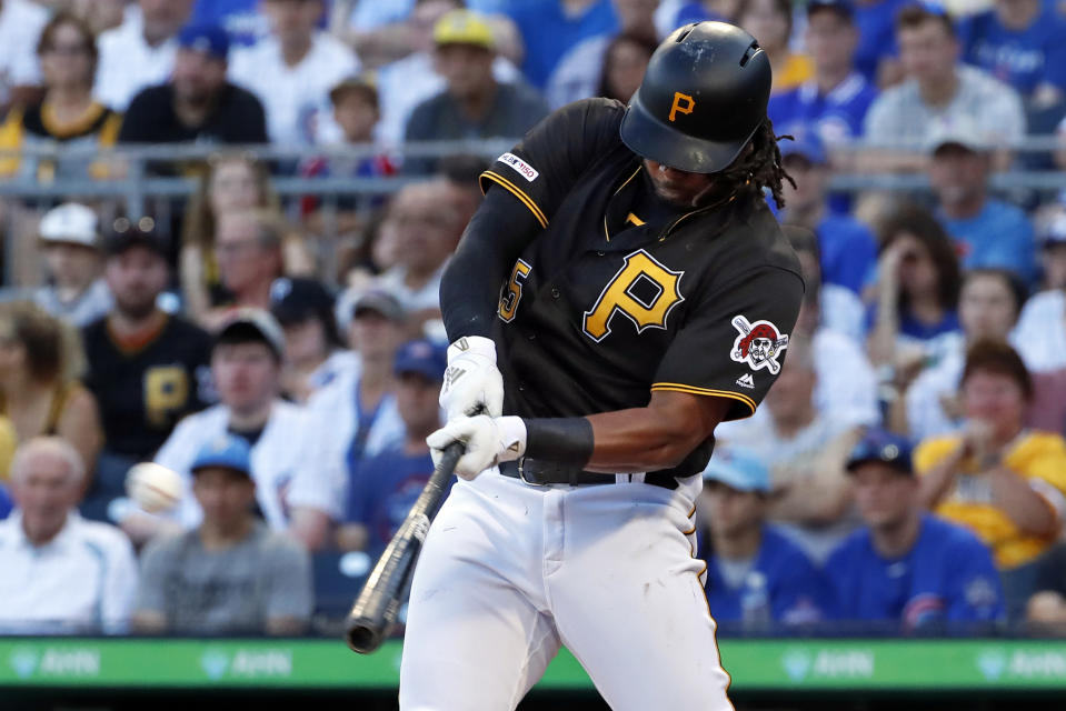 FILE - In this July 1, 2019, file photo, Pittsburgh Pirates' Josh Bell hits a three-run home run off Chicago Cubs starting pitcher Adbert Alzolay during the first inning of a baseball game in Pittsburgh. Bell is among eight competitors in this year’s All-Star Game Home Run Derby, which is handing out a $1 million prize to the winner. (AP Photo/Gene J. Puskar, File)