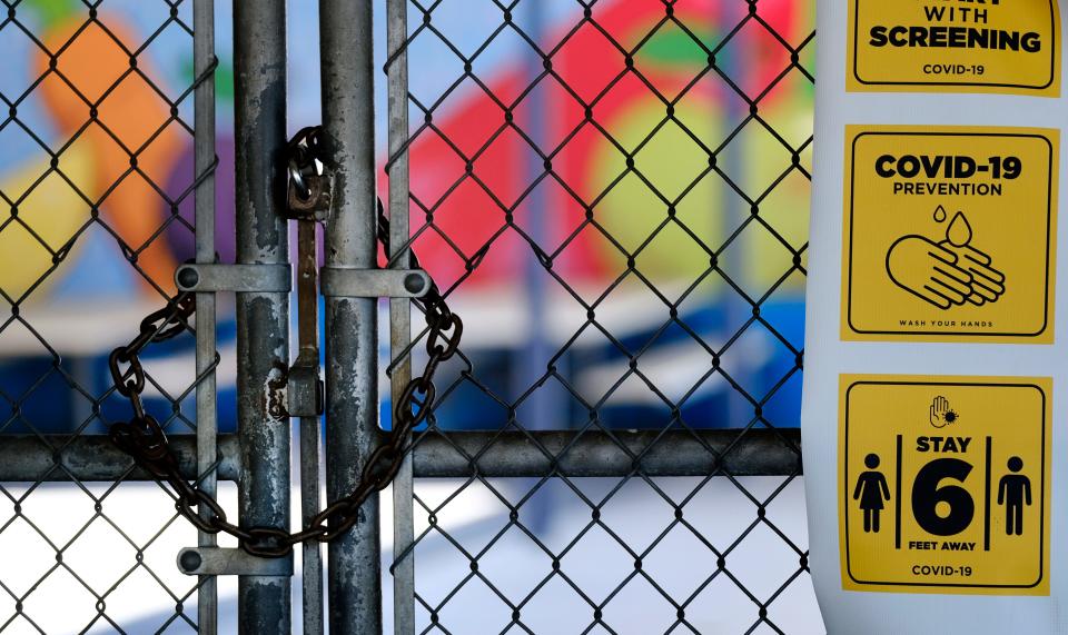 In this July 13, 2020, file photo, a gate is locked at the closed Ranchito Elementary School in the San Fernando Valley section of Los Angeles.