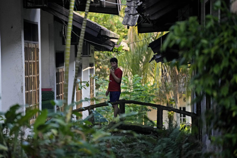 An Afghan refugee walks at a resort turned into a shelter in Tanjungpinang, Bintan Island, Indonesia, Tuesday, May 14, 2024. Indonesia, despite having a long history of accepting refugees, is not a signatory to the U.N. Refugee Convention of 1951 and its 1967 Protocol, and the government does not allow refugees and asylum-seekers to work.(AP Photo/Dita Alangkara)