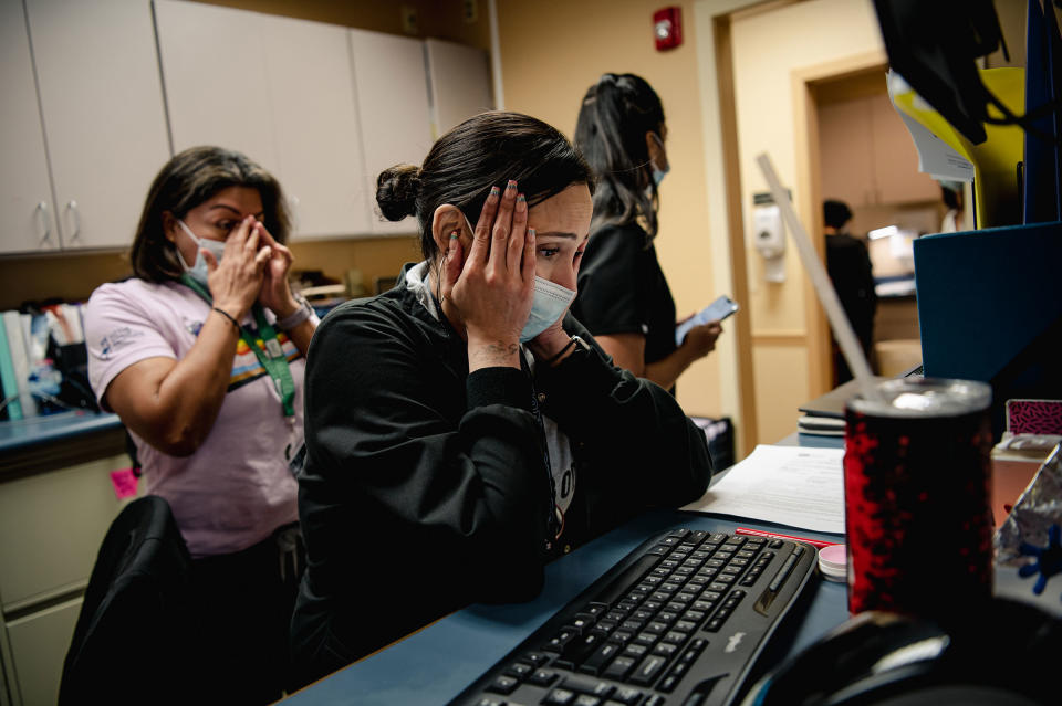 Nina, (center) and Priscilla (left), staff members of the Houston Women's Clinic, the largest abortion provider in the city, react immediately after learning of the Supreme Court's decision to overturn Roe v. Wade, and reverse American women's constitutional right to an abortion, on June 24.<span class="copyright">Meridith Kohut for The New Yorker</span>