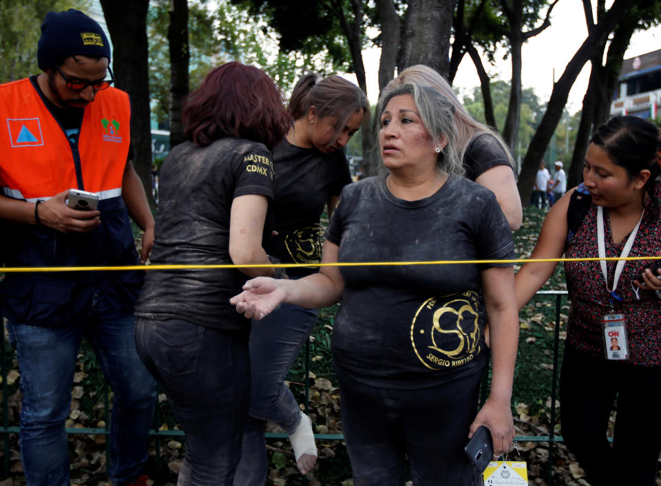 A woman reacts after she and others were rescued.&nbsp;