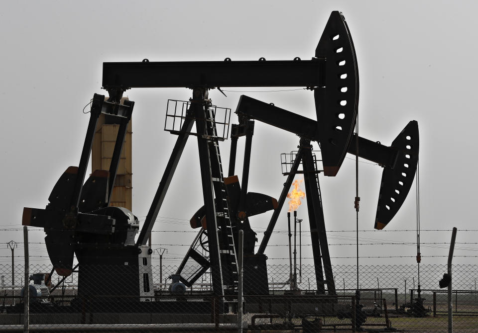 FILE - This March 27, 2018 file photo, shows an oilfield controlled by a U.S-backed Kurdish group, in Rmeilan, Hassakeh province, Syria. President Donald Trump's decision to dispatch new U.S. forces to eastern Syria to secure oil fields is being criticized by some experts as ill-defined and ambiguous. But the residents of the area, one of the country's most remote and richest regions, hope the U.S. focus on eastern Syria would bring an economic boon and eliminate what remains of the Islamic State group. (AP Photo/Hussein Malla, File)