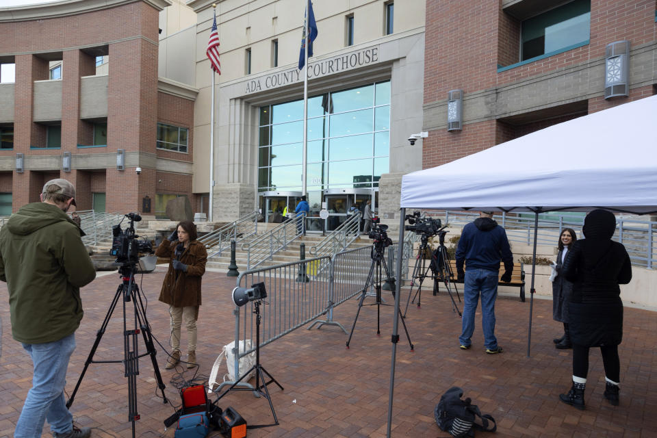 Media gather outside the Ada County courthouse in Boise, Idaho, Monday, April 3, 2023, on the first day of jury selection in the Lori Vallow Daybell murder trial. Vallow Daybell and her boyfriend Chad Daybell are being tried separately for the murders of Vallow Daybell's two youngest children Joshua "JJ" Vallow (7) and Tylee Ryan (17). (AP Photo/Kyle Green)