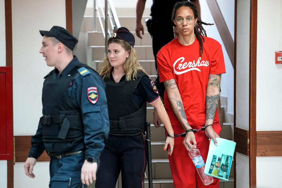 WNBA star and two-time Olympic gold medalist Brittney Griner is escorted to a courtroom on 7 July 2022 (AP)