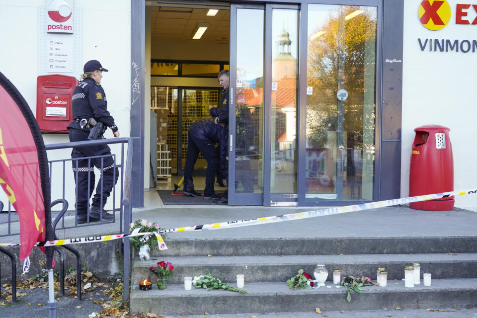 Police at the scene of the Extra store involved in the bow and arrow attack, in Kongsberg, Norway, Friday, Oct. 15, 2021. The suspect in a bow-and-arrow attack that killed five people and wounded three in a small Norwegian town is facing a custody hearing Friday. He won’t appear in court because he has has confessed to the killings and has agreed to being held in custody. (Terje Bendiksby/NTB via AP)