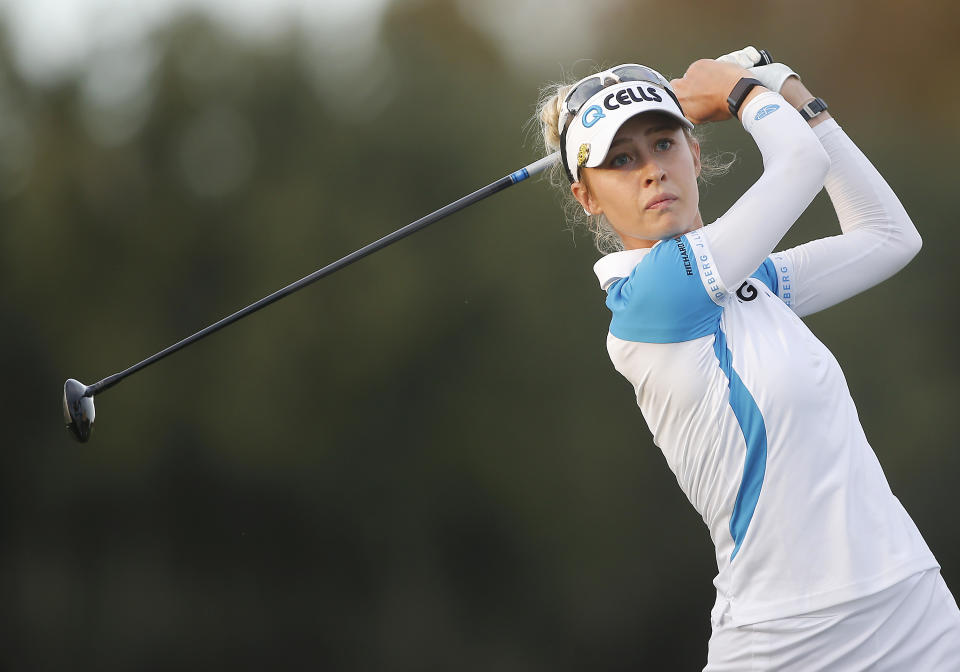 ORLANDO, FL - DECEMBER 18: Nelly Korda takes his approach shot on the 18th hole during the first round of the PNC Championship on December 18, 2021 at The Ritz-Carlton Golf Club in Orlando, FL.(Photo by Russell Lansford/Icon Sportswire via Getty Images)