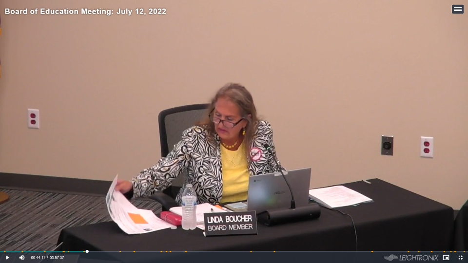 Elmbrook school board member Linda Boucher wears an anti-critical race theory button at a school board meeting on July 12