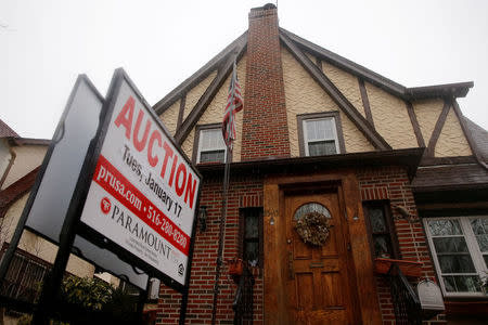 FILE PHOTO: A childhood home of U.S. President-elect Donald Trump is seen with an auction sign in the Queens borough of New York, U.S., January 17, 2017. REUTERS/Shannon Stapleton/File Photo