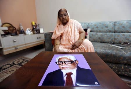 Zakia Jafri shows a photograph of her late husband Ehsan Jafri, a lawmaker for the Congress party which now sits in opposition, who was hacked to death by a Hindu mob in riots, inside her son's house in Surat, India, September 15, 2015. REUTERS/Amit Dave