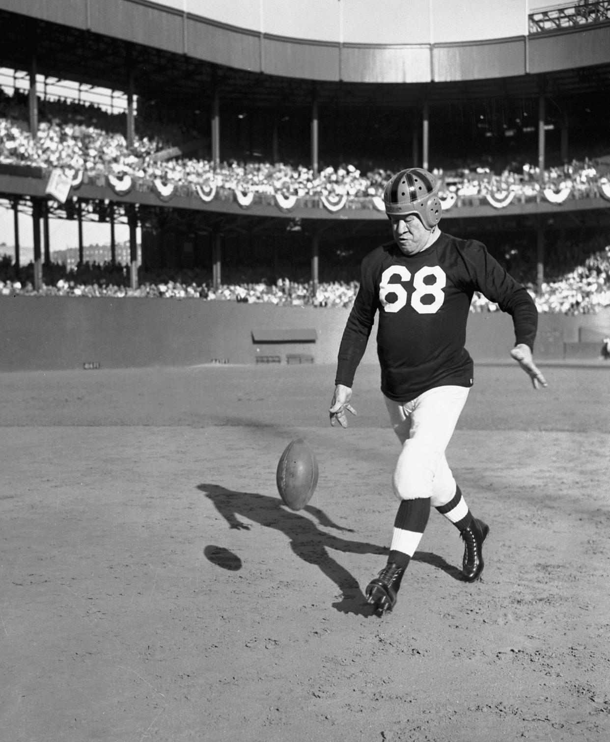 FILE - Jim Thorpe, the 61-year-old former Olympic athlete, gives a drop kicking exhibition at half-time of the Israeli-U.S. international soccer match at the Polo Grounds in New York City on Sept. 26, 1948. Jim Thorpe has been reinstated as the sole winner of the 1912 Olympic pentathlon and decathlon — nearly 110 years after being stripped of those gold medals for violations of strict amateurism rules of the time. The International Olympic Committee confirmed that an announcement was planned later Friday, July 15, 2022. (AP Photo, File)