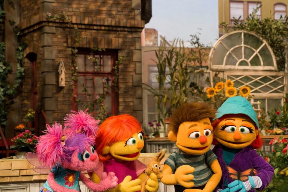 Abby with Julia and her family on Sesame Street | RICHARD TERMINE/Sesame Workshop