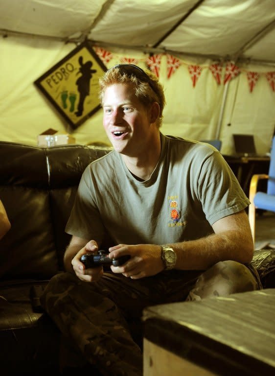 Prince Harry plays computer games at Camp Bastion in Afghanistan's Helmand Province on November 3, 2012