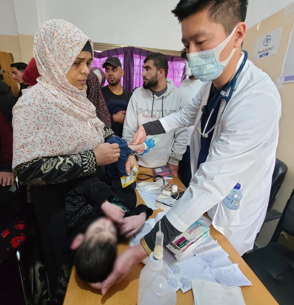 Dr. Yipeng Ge, right, recently returned from a week-long assignment in Rafah, southern Gaza. He travelled there with an aid group called Humanity Auxilium.