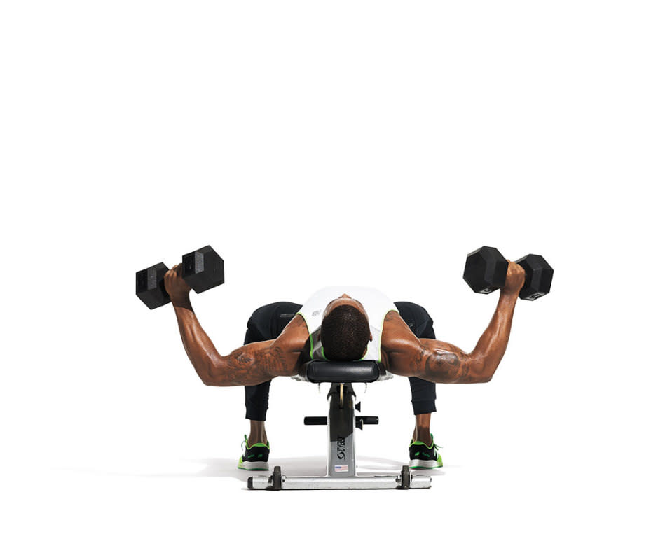 How to do it:<ol><li>Lie back on a flat bench with a dumbbell in each hand, held above your chest. Lower the weights out to the side, opening your arms wide.</li><li>Feel a stretch in your pecs. Bring the weights halfway up, then return them back to the bottom position. That’s one rep.</li><li>Take three seconds to lower your arms and three to bring them halfway up on each rep.</li></ol>