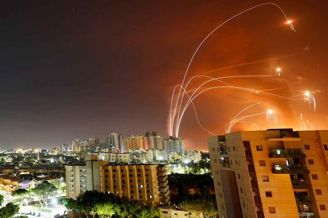 Streaks of light are seen as Israel's Iron Dome anti-missile system intercept rockets launched from the Gaza Strip towards Israel, as seen from Ashkelon, Israel. (Reuters/Amir Cohen