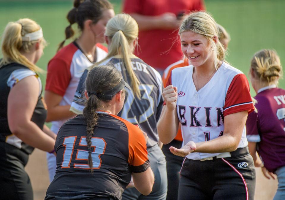 Pekin's Broghan Hall, facing, plays "Rock, Paper, Scissors" with Illini Bluffs' Zoe Eeten during a game between innings of the Senior Salute All-Star softball game Wednesday, June 14, 2023 at the Louisville Slugger Sports Complex in Peoria.