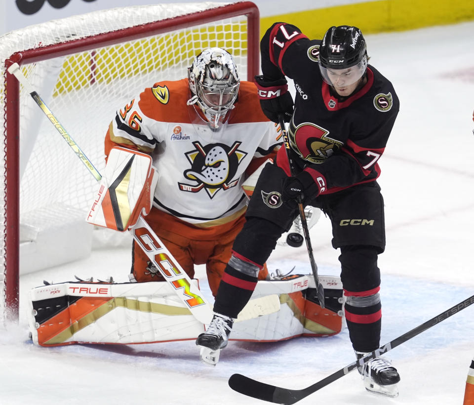 Ottawa Senators' Ridly Greig tries to tip the puck past Anaheim Ducks goaltender John Gibson during the first period of an NHL hockey game, Wednesday, Dec. 11, 2024 in Ottawa, Ontario. (Adrian Wyld/The Canadian Press via AP)