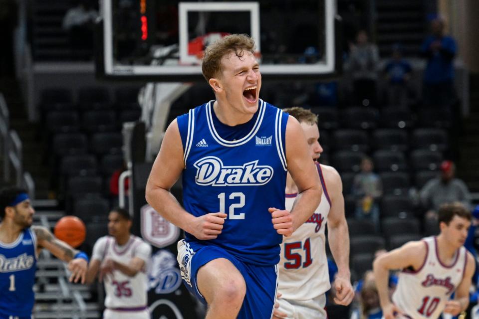 Drake guard Tucker DeVries (12) reacts after scoring a 3-point basket against Bradley during the second half of the championship game in the Missouri Valley Conference NCAA basketball tournament Sunday, March 5, 2023, in St. Louis.