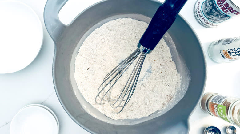 flour in metal bowl with whisk