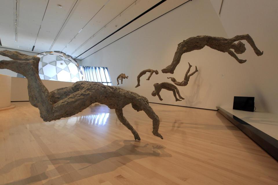 In this Nov. 9, 2012 Chen Quilin's Floating series is displayed at the Eli and Edythe Broad Art Museum on Michigan State University's campus in East Lansing, Mich. (AP Photo/Carlos Osorio)