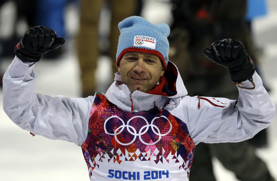 Norway's Ole Einar Bjoerndalen celebrates after clinching the gold medal in the men's biathlon 10k sprint, at the 2014 Winter Olympics, Saturday, Feb. 8, 2014, in Krasnaya Polyana, Russia. (AP Photo/Kirsty Wigglesworth)