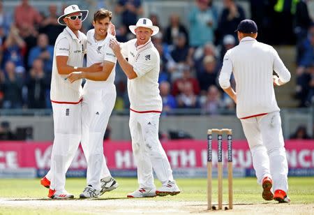 Cricket - England v Australia - Investec Ashes Test Series Third Test - Edgbaston - 30/7/15 England's Steven Finn celebrates the wicket of Australia's Steven Smith with team mates Action Images via Reuters / Carl Recine Livepic