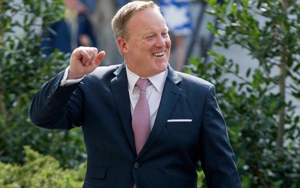 Outgoing White House Press Secretary Sean Spicer gestures outside the West Wing of the White House  - Credit: Michael Reynolds/EPA